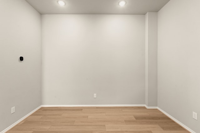 unfurnished room with light hardwood / wood-style floors