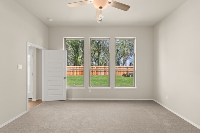 carpeted empty room with ceiling fan