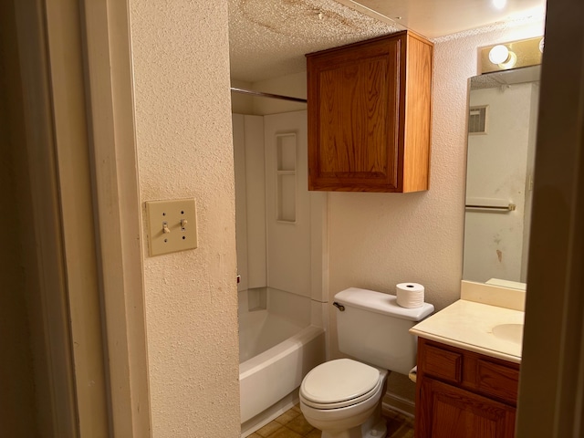 full bathroom with vanity, a textured ceiling, toilet, and shower / washtub combination