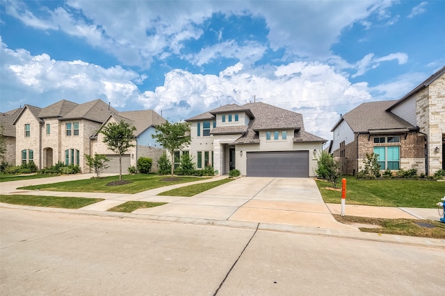 view of front of house with a garage and a front yard