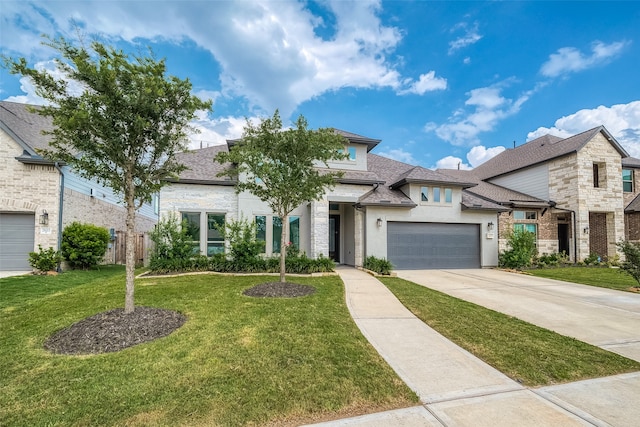 view of front of home with a garage and a front yard