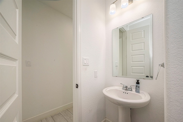 bathroom with hardwood / wood-style flooring