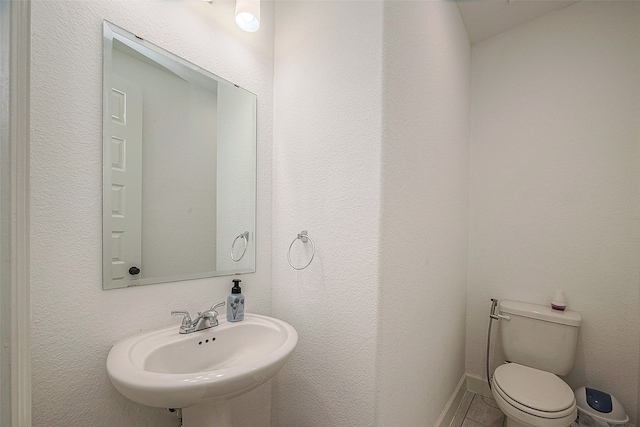 bathroom with toilet and sink