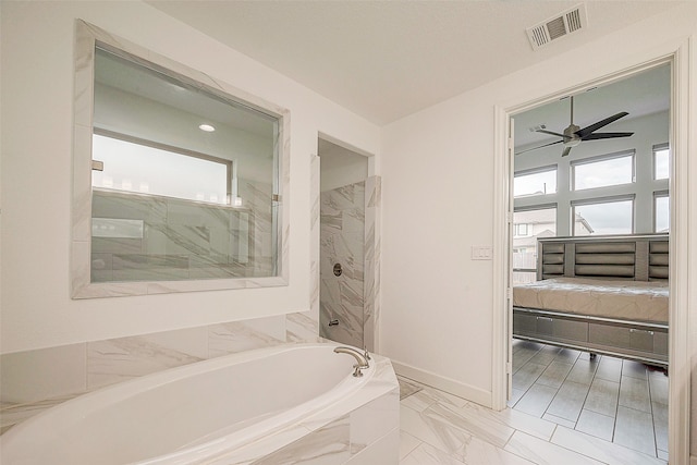 bathroom featuring ceiling fan and separate shower and tub