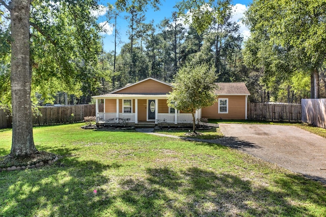 single story home with a porch and a front yard