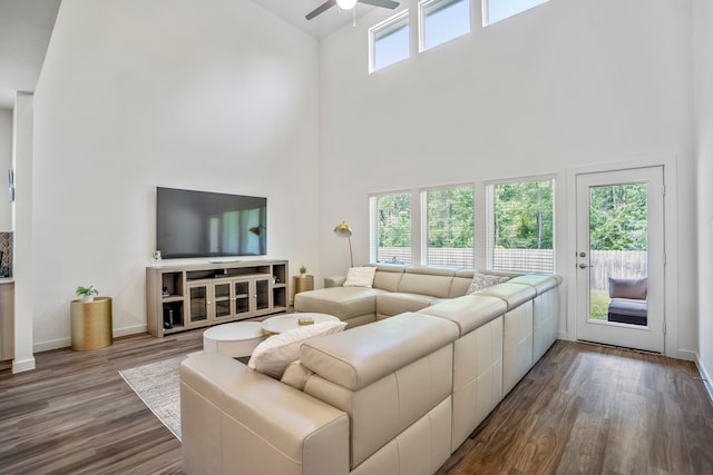 living room with high vaulted ceiling, hardwood / wood-style floors, and ceiling fan