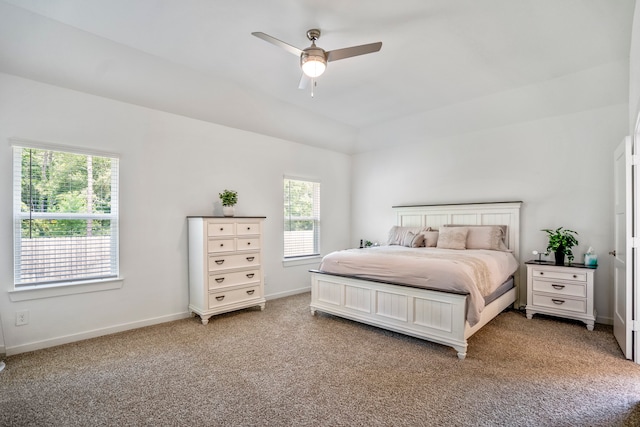 bedroom with carpet, multiple windows, and ceiling fan