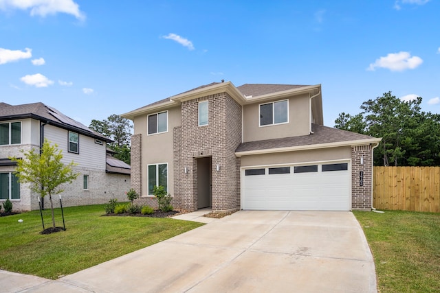 view of front facade featuring a garage and a front lawn