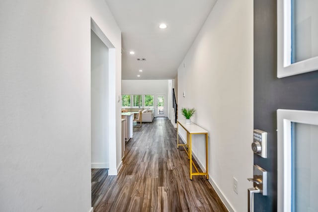 hallway featuring dark hardwood / wood-style floors