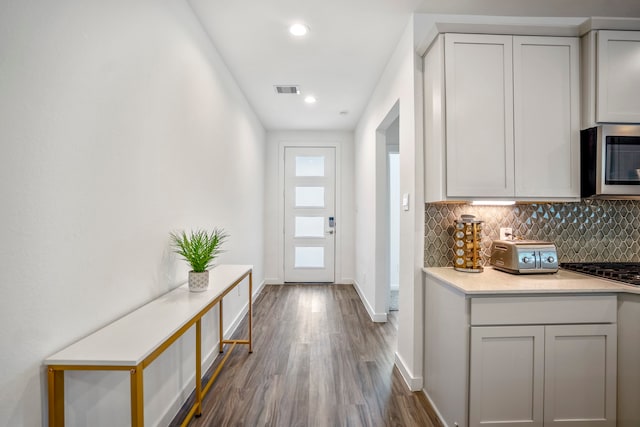 entryway with hardwood / wood-style floors