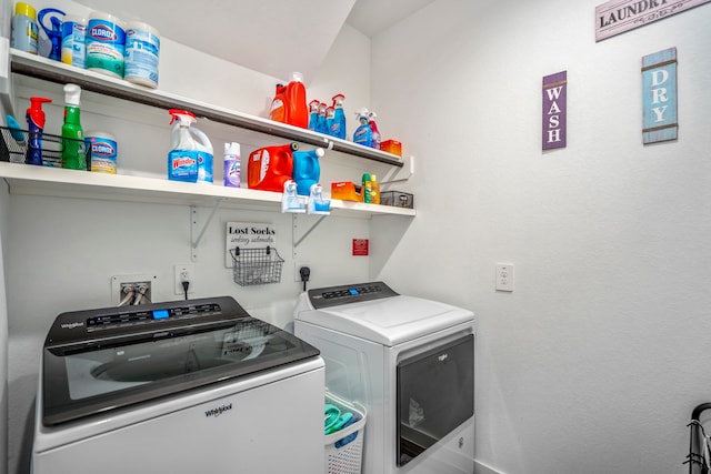 laundry area with washing machine and dryer