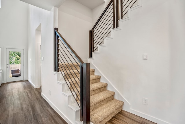 staircase featuring hardwood / wood-style floors