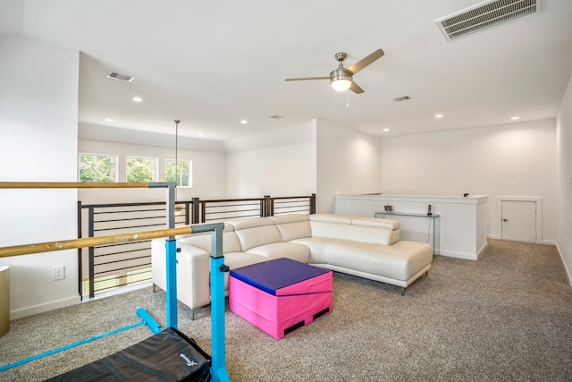 living room with ceiling fan and carpet floors