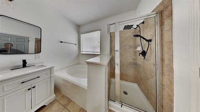 bathroom featuring vanity and independent shower and bath