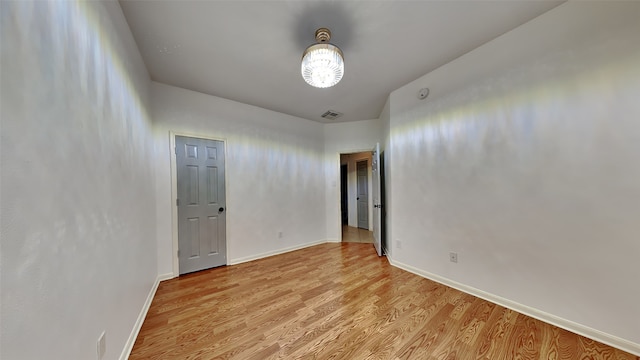 spare room featuring light hardwood / wood-style flooring