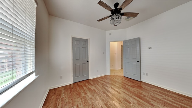 unfurnished bedroom featuring ceiling fan and light hardwood / wood-style flooring