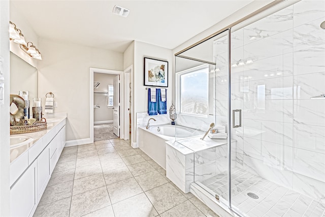 bathroom featuring vanity, separate shower and tub, and tile patterned floors