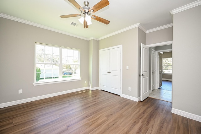 6122 Hopper Rd, Houston, TX 77016 - unfurnished bedroom with wood finished floors, crown molding, baseboards, a closet, and ceiling fan