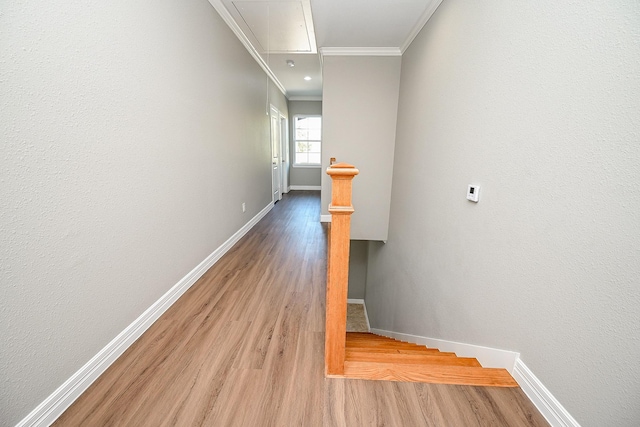6122 Hopper Rd, Houston, TX 77016 - staircase featuring attic access, ornamental molding, baseboards, and wood finished floors