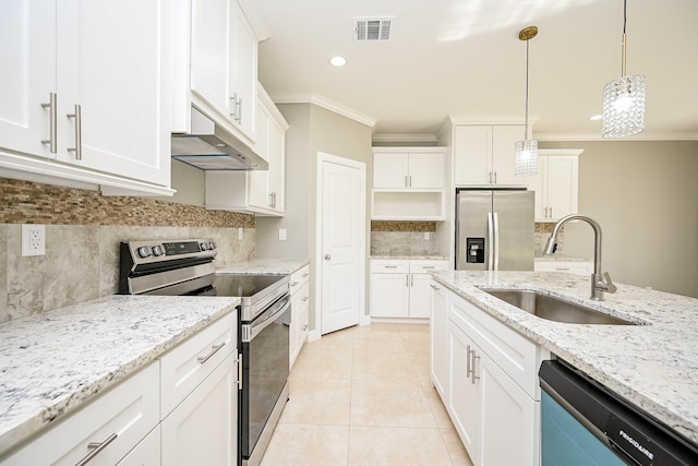 kitchen featuring white cabinetry, appliances with stainless steel finishes, pendant lighting, light stone countertops, and sink