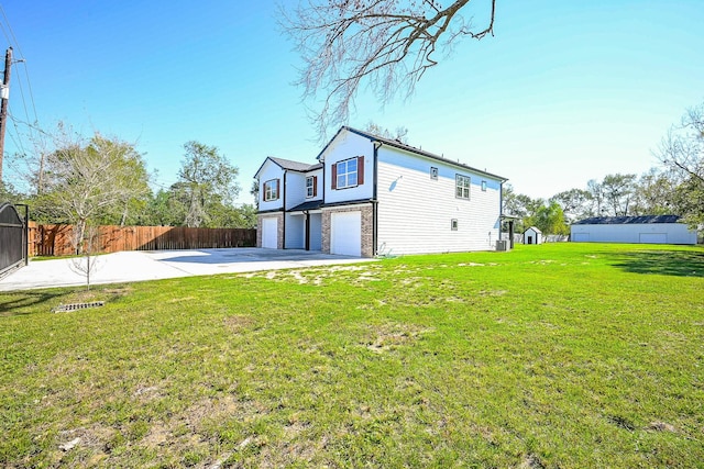 6122 Hopper Rd, Houston, TX 77016 - rear view of house with a garage and driveway