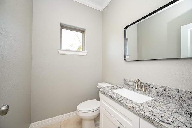 6122 Hopper Rd, Houston, TX 77016 - bathroom featuring crown molding, toilet, vanity, tile patterned flooring, and baseboards