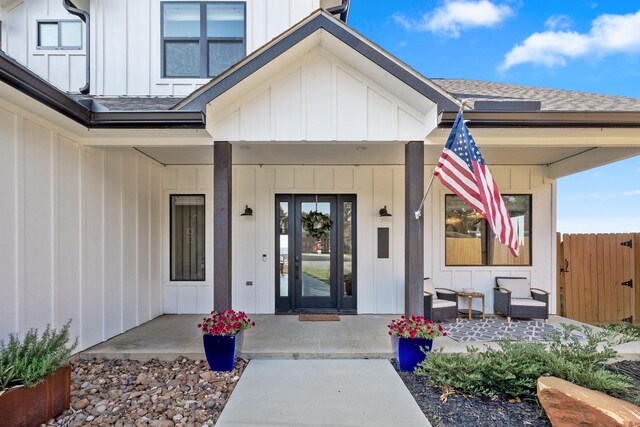 view of exterior entry with covered porch