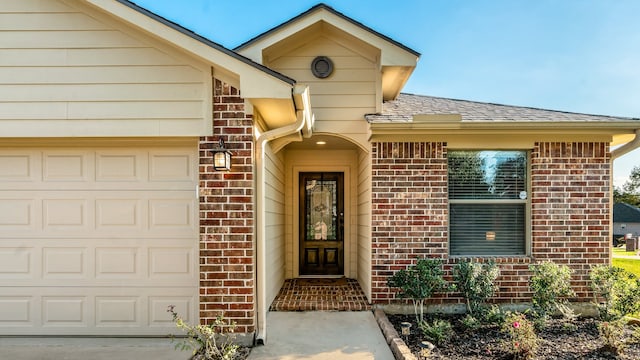 property entrance with a garage