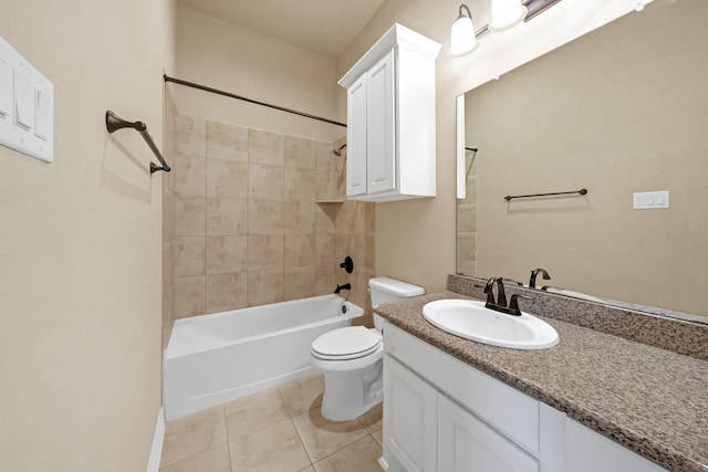 full bathroom with tile patterned floors, vanity, tiled shower / bath combo, and toilet