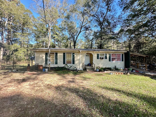 ranch-style house with a carport and a front yard