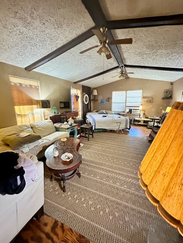 carpeted bedroom featuring lofted ceiling with beams, a textured ceiling, and ceiling fan