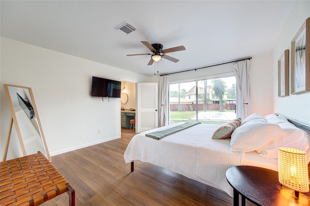 9932 Shady Dr, Houston, TX 77016 - bedroom with access to outside, wood finished floors, baseboards, connected bathroom, and ceiling fan