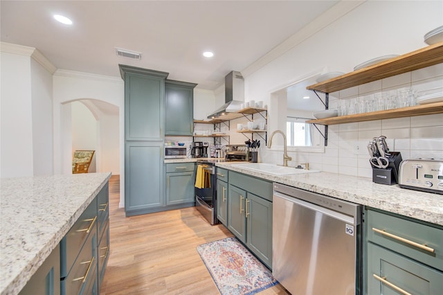 9932 Shady Dr, Houston, TX 77016 - kitchen with stainless steel appliances, open shelves, a sink, crown molding, and light wood finished floors