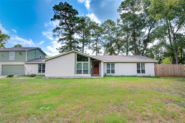 9932 Shady Dr, Houston, TX 77016 - view of front of house with brick siding and an attached garage