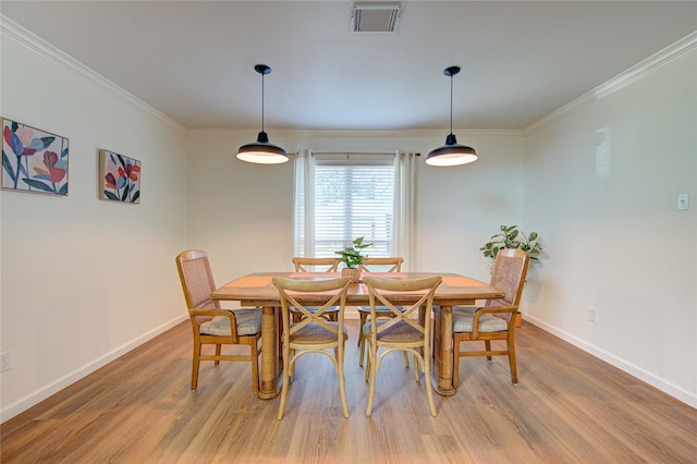 9932 Shady Dr, Houston, TX 77016 - dining area featuring light wood finished floors, ornamental molding, and baseboards