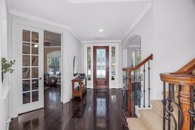 entrance foyer featuring dark hardwood / wood-style floors and ornamental molding