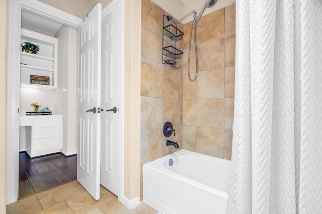 bathroom featuring tile patterned floors and shower / tub combo with curtain