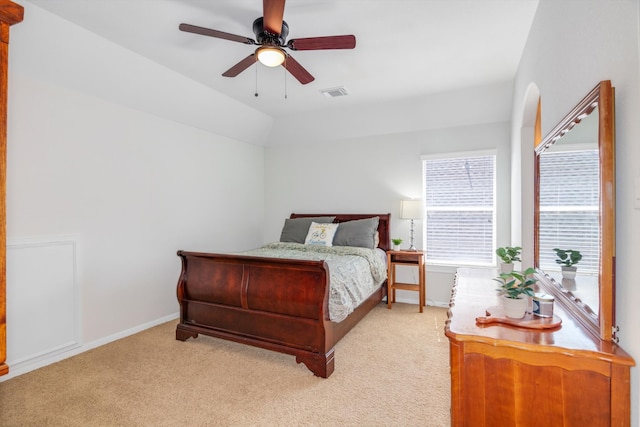 carpeted bedroom featuring vaulted ceiling and ceiling fan