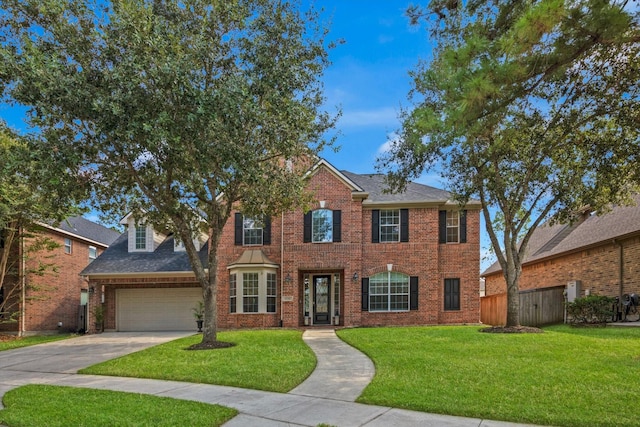 view of front facade with a garage and a front yard