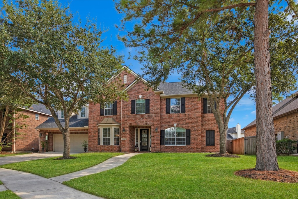 17210 Ross Lake Ct, Humble, TX 77346 - view of front of home with a garage and a front yard