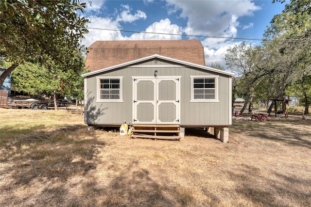 view of outbuilding with a lawn