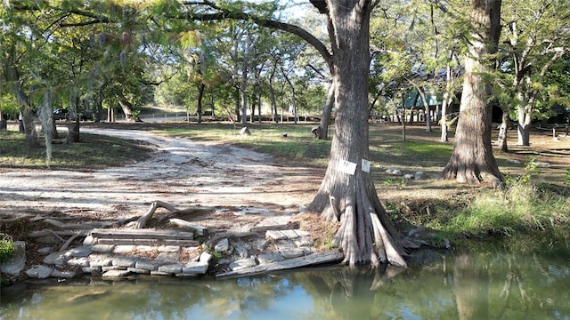 surrounding community with a water view