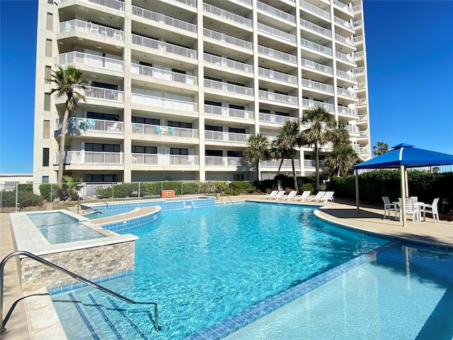 view of swimming pool featuring a patio area