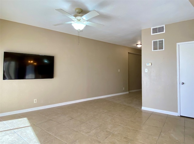 empty room featuring ceiling fan and light tile patterned floors