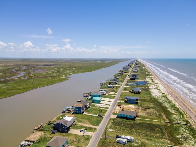 bird's eye view with a water view and a view of the beach