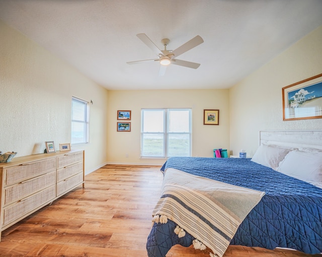 bedroom featuring light wood-type flooring and ceiling fan