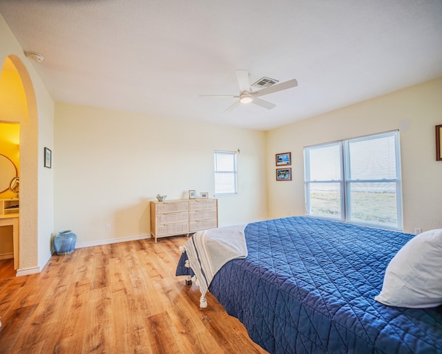 bedroom featuring ceiling fan and light hardwood / wood-style flooring