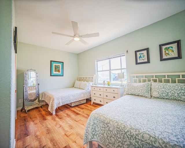 bedroom featuring light hardwood / wood-style flooring and ceiling fan