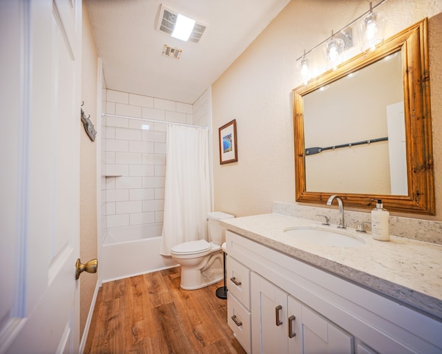 full bathroom with toilet, vanity, hardwood / wood-style flooring, and shower / bathtub combination with curtain