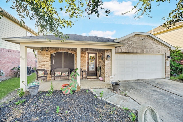 ranch-style home featuring a porch and a garage